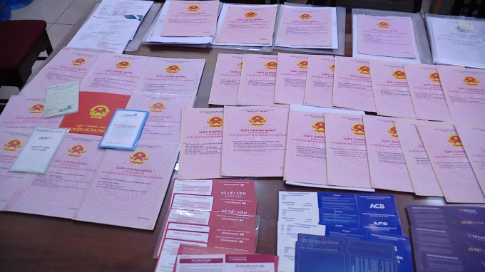 1-copy-1755318212-5796-1755318268 125 bất động sản liên quan nhóm Nam bị phong tỏa giao dịch. Ảnh: Công an cung cấp
